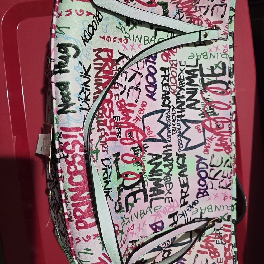 Brand new shoulder bag with tags on the bigger bag